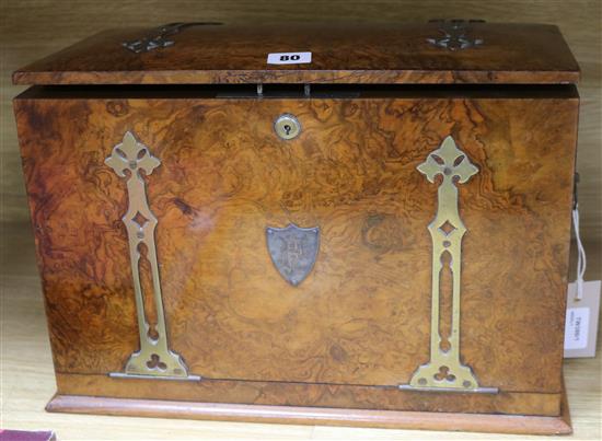 A Victorian brass-bound burr walnut stationery compendium, with strapwork decoration and slightly domed top, H 11 x W 16 x D 8.25in
